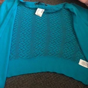 This is a cloth jacket it really soft never been worn. It’s blue.